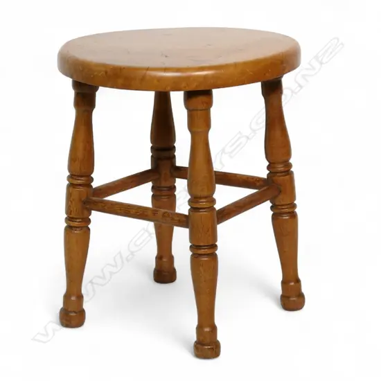 A c.1900 solid burr wood circular topped stool,